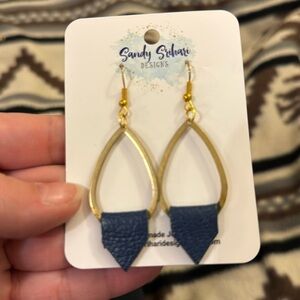 Gold earrings with blue leather accent